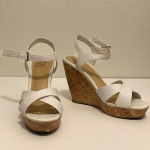 White strapy wedge heels.